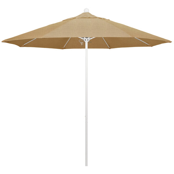 A tan California Umbrella with a white pole.