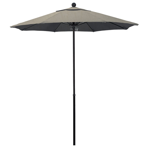 A California Umbrella with a black and tan Sunbrella canopy on a black pole.