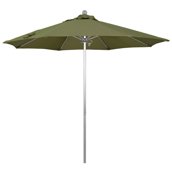 A green California Umbrella on a silver pole.