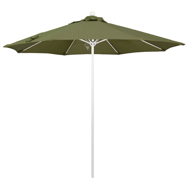 A green California Umbrella with Terrace Fern fabric on a white pole.