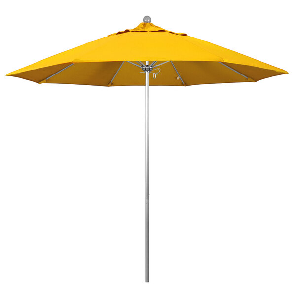 A California Umbrella ALTO round yellow umbrella with a silver aluminum pole.