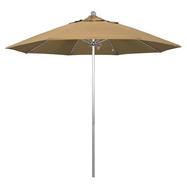 A close-up of a straw-colored California Umbrella on a silver metal pole.