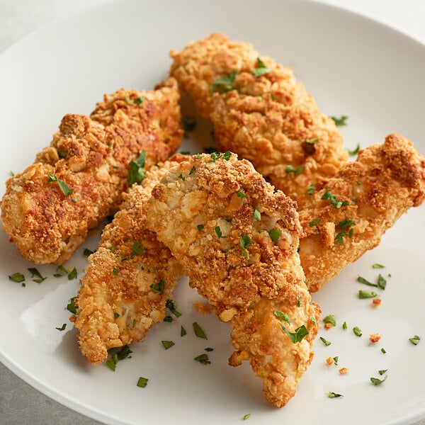 A plate of fried chicken strips coated with Nabisco Ritz bread crumbs.