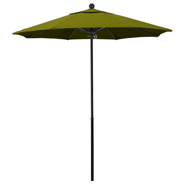 A green umbrella with a Pacifica canopy on a black pole with a round ball on top.