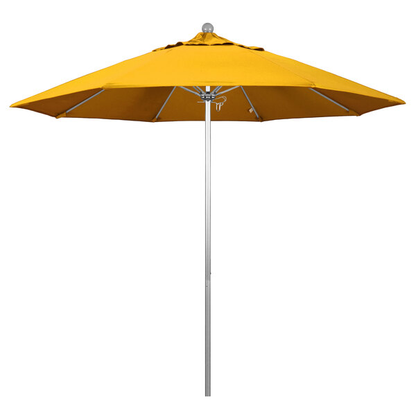 A California Umbrella with a yellow Pacifica canopy on a silver aluminum pole.