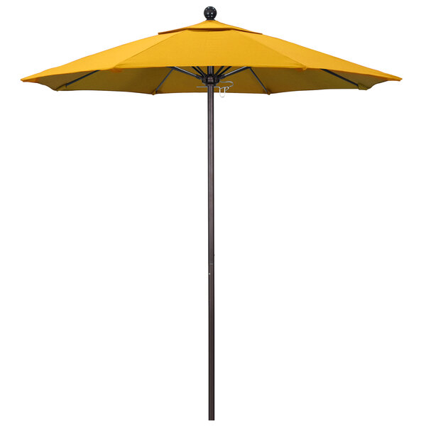 A California Umbrella with Sunflower Yellow Sunbrella Canopy on a Bronze Pole.