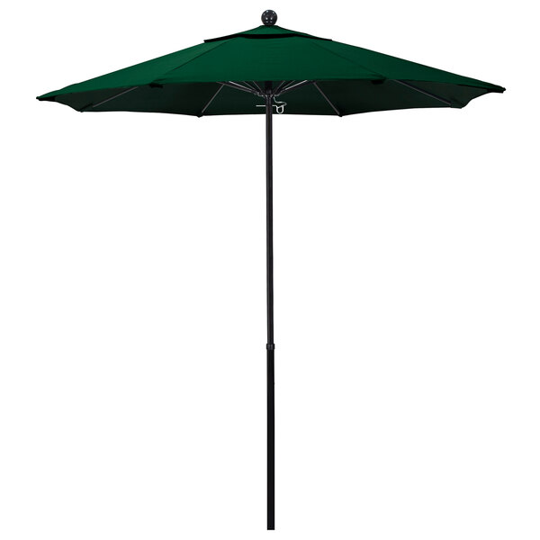 A green California Umbrella with a black pole.