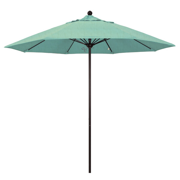 A California Umbrella ALTO round outdoor umbrella with blue Sunbrella canopy.