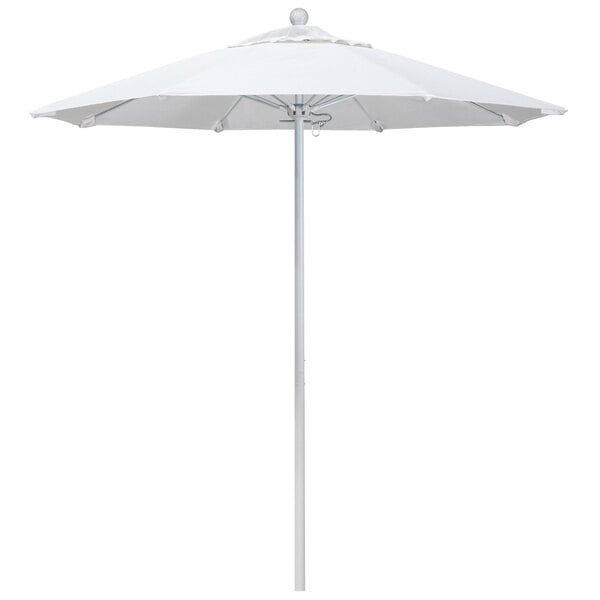 A white umbrella with a round top and a metal pole.