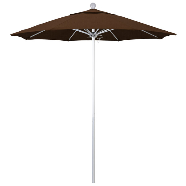 A brown California Umbrella ALTO round umbrella with a white pole.