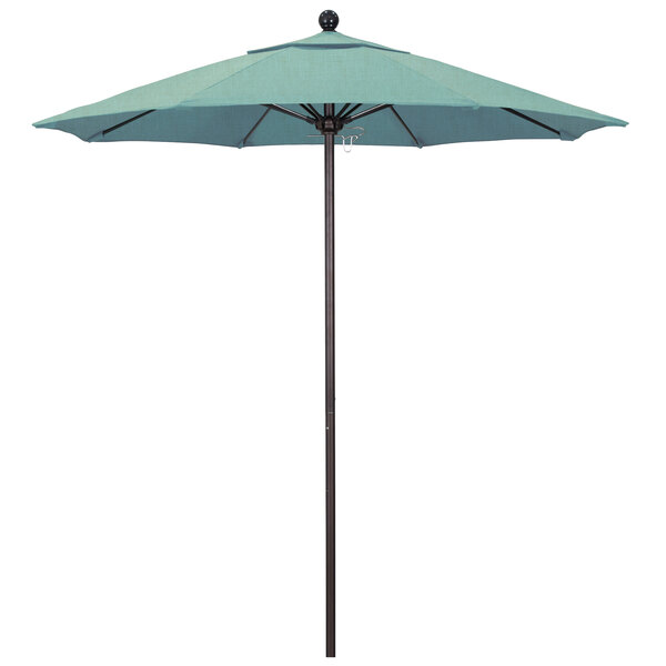 A close-up of a blue California Umbrella on a bronze metal pole.