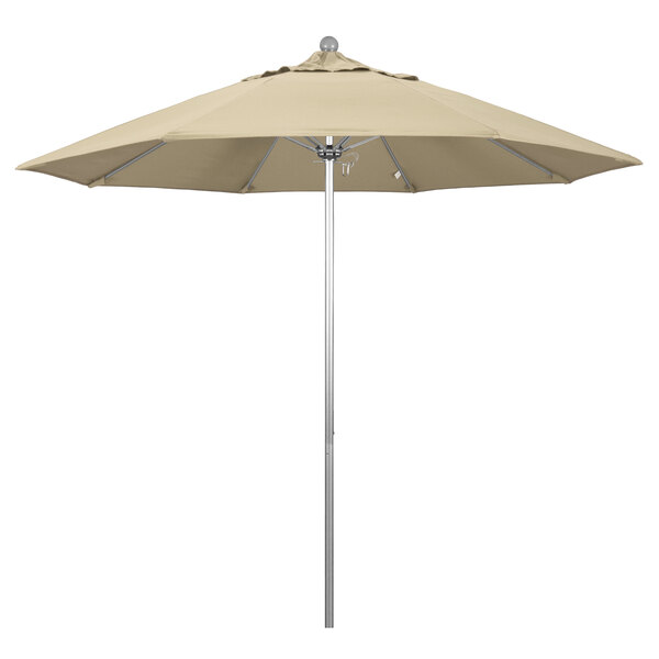 A California Umbrella with a beige Pacifica canopy on a silver metal pole.