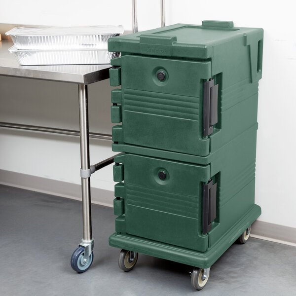 A granite green Cambro Ultra Camcart food pan carrier on wheels.