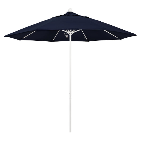 A navy blue California Umbrella with a white pole.