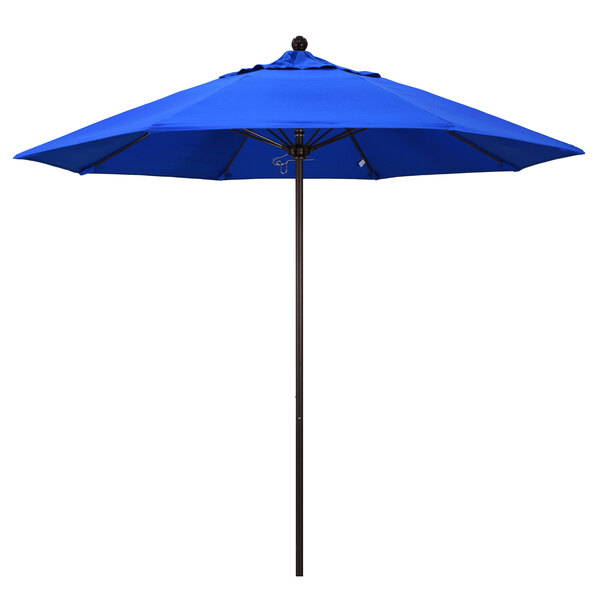 A California Umbrella ALTO round blue umbrella with a bronze pole.