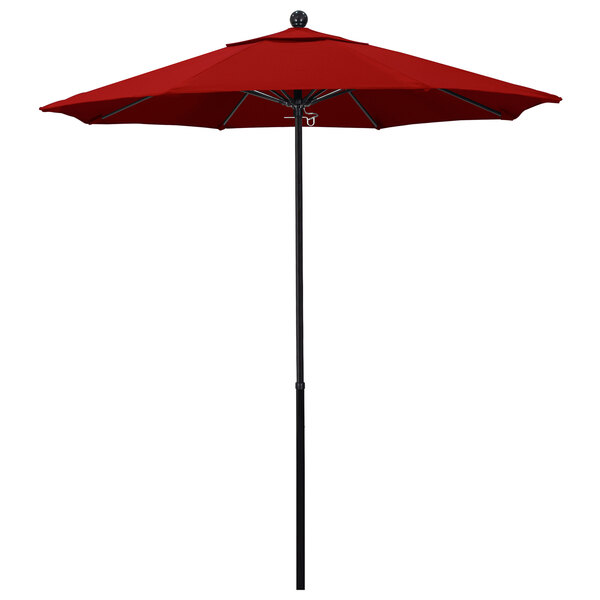 A close up of a red California Umbrella with a black pole.