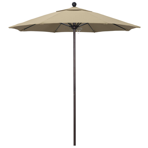 A California Umbrella Pacifica beige umbrella with a bronze pole.