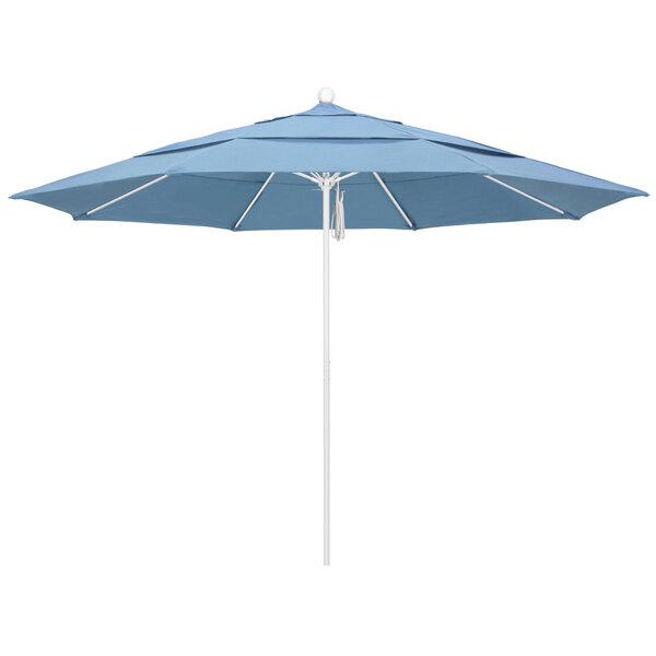 A close-up of a blue California Umbrella with a white pole.