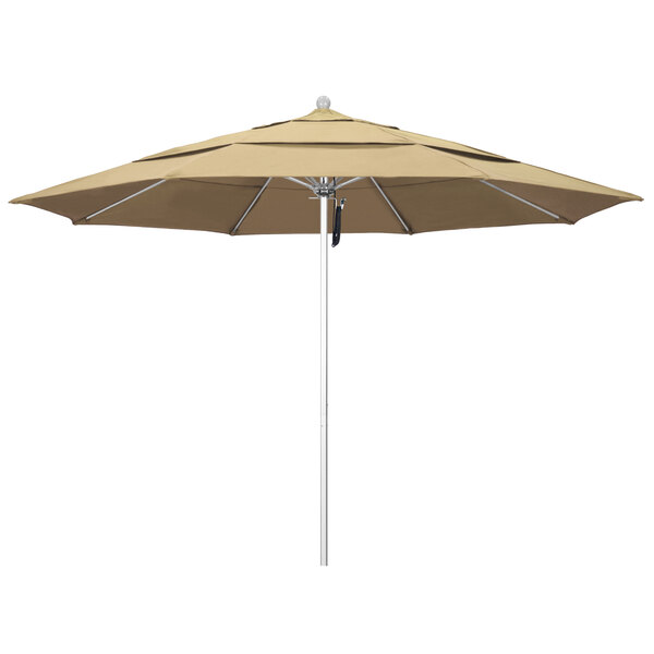 A close-up of a California Umbrella with a Pacifica beige canopy.
