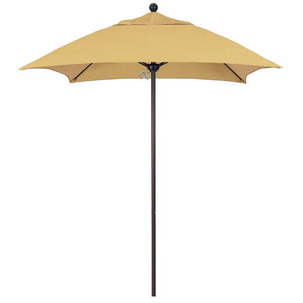A California Umbrella ALTO 604 Sunbrella patio umbrella with a yellow canopy on a bronze pole.