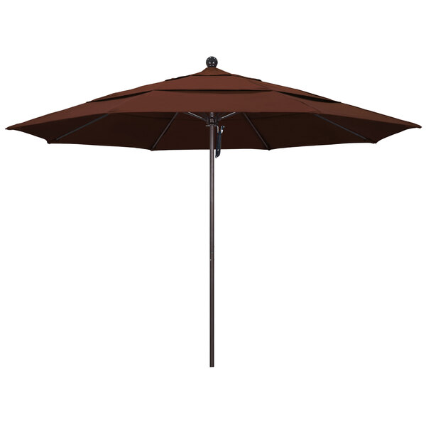 A close-up of a brown California Umbrella with a bronze pole.