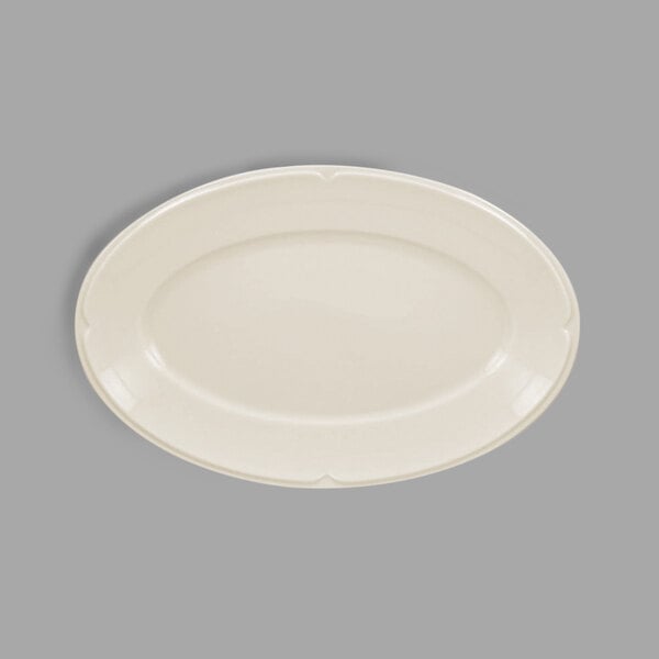 An ivory porcelain oval platter with a curved edge.