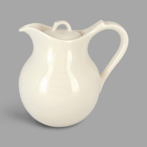 A white RAK Porcelain teapot with a handle.