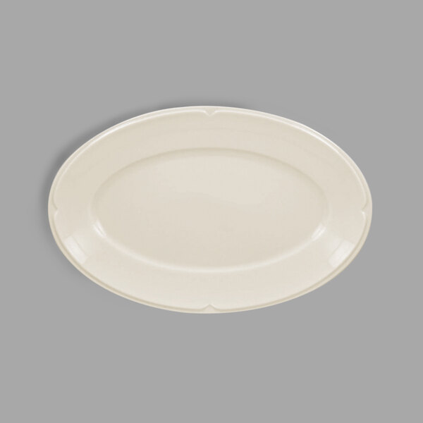 A white porcelain oval platter with a curved edge.