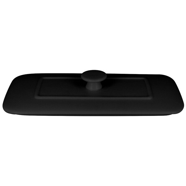 A black rectangular lid with a round handle.