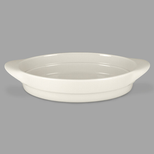 A white oval dish with a handle.
