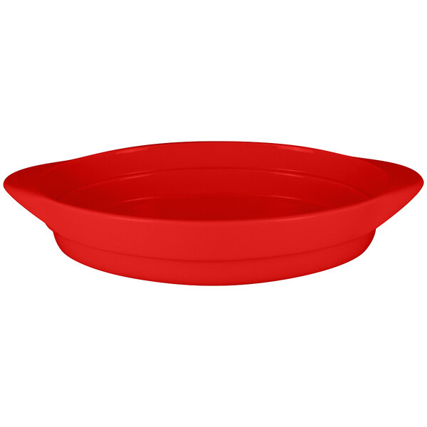 A RAK Porcelain Ember Red oval serving dish with a curved edge.