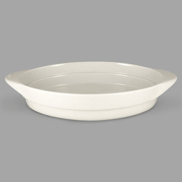 A white oval RAK Porcelain serving dish with a handle.