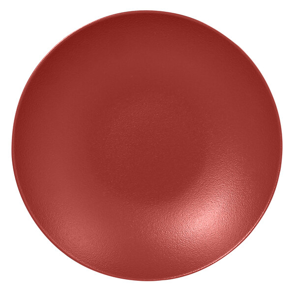A RAK Porcelain deep coupe plate with a dark red surface.