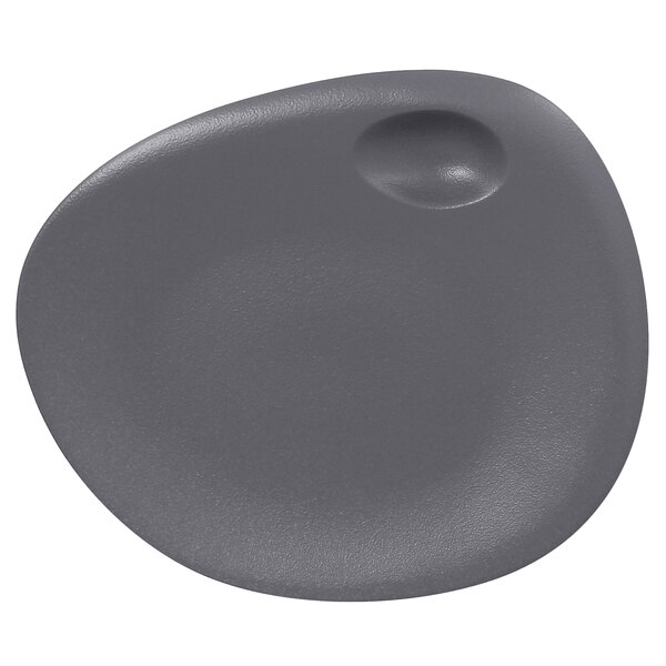 A RAK Porcelain stone gray porcelain coupe plate with a small hole in the middle.