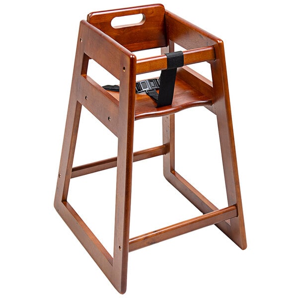 A CSL Youngstar wooden high chair with black strap.