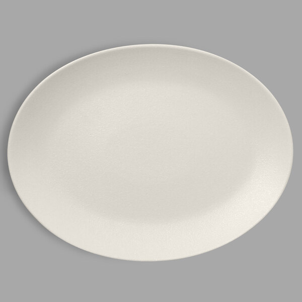 A white RAK Porcelain oval coupe platter with a small rim.