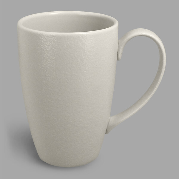A close-up of the white handle on a RAK Porcelain Neo Fusion mug.
