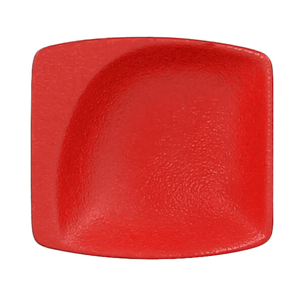A red porcelain mini square dish with a curved edge.