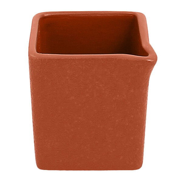 A brown square RAK Porcelain creamer with a curved edge.