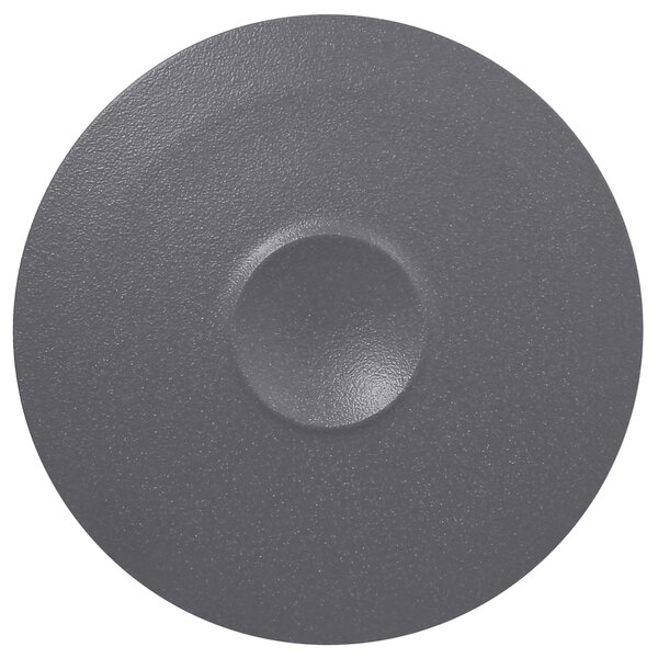 A RAK Porcelain stone gray porcelain plate with a circle in the middle.