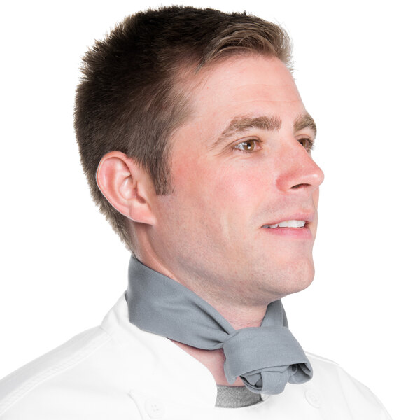 A man wearing a gray Intedge chef neckerchief.