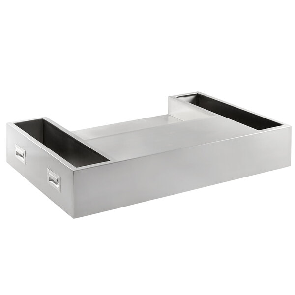 A silver stainless steel tray with two compartments on a counter.