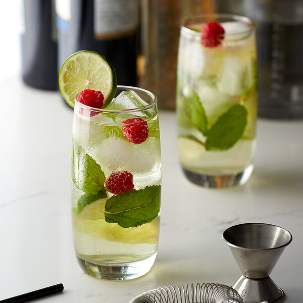 A glass of Monin sugar free sweetener lemonade with raspberries and mint.