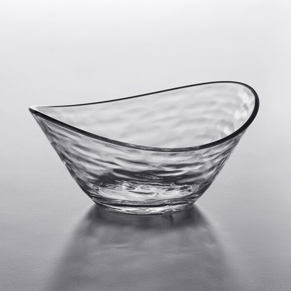 A clear plastic Libbey small snack bowl with a curved edge.