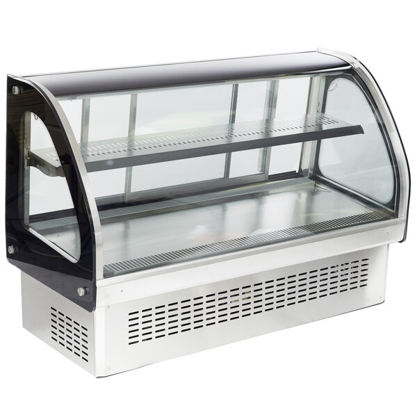 A Vollrath curved glass refrigerated countertop display cabinet on a counter.