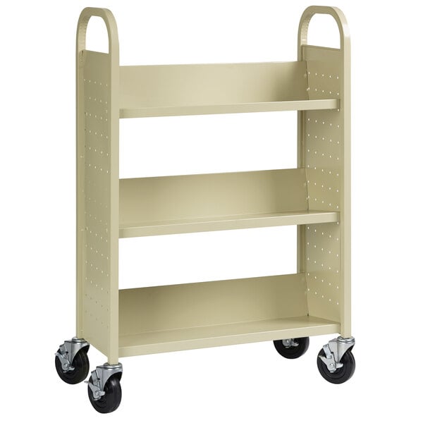 A beige 3-shelf book cart with black wheels.