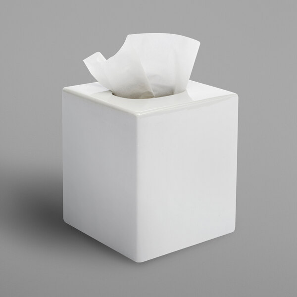 A white Focus Hospitality square ceramic tissue box cover with tissue paper inside.