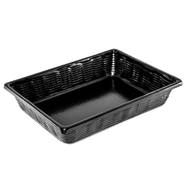 A Marco Company black rectangular plastic basket with a wicker look on a counter.