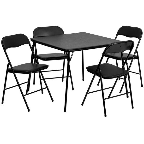 A black square folding table with four black folding chairs.