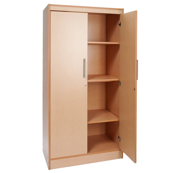 A Whitney Brothers wooden storage cabinet with shelves and doors.